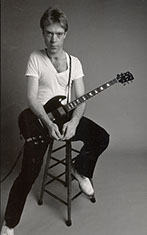 picture of King Cormack holding a Gibson Les Paul